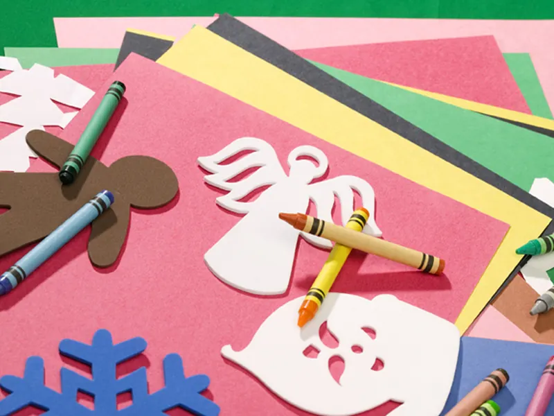 Coloured paper and pencils for an art activity
