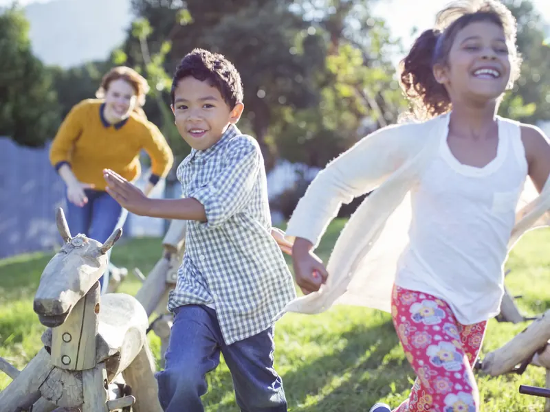 Children running on the grass