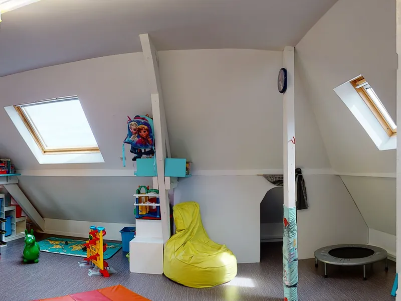 The attic movement room, with mats and a trampoline